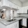 a kitchen with white cabinets