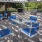 a group of tables and chairs outside